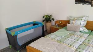 a small bedroom with a bed and a tv at Ferienwohnung, Sauna & Gästekarte gratis im Schwarzwald in Baiersbronn +29 photos