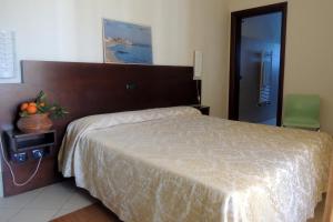 Posteľ alebo postele v izbe v ubytovaní Hotel Villa Ionia