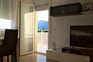 TV a/nebo společenská místnost v ubytování Playa, Port Aventura, Golf, wifi y Parking