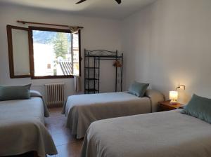 Posteľ alebo postele v izbe v ubytovaní Hostal Nadal