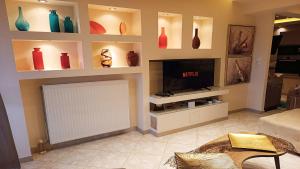 TV a/nebo společenská místnost v ubytování Anastasia Luxury Suites by Xenius Zeus in Nea Flogita