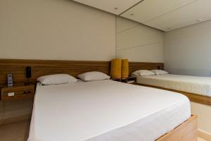 Postel nebo postele na pokoji v ubytování Motel Maresias - Radial Leste