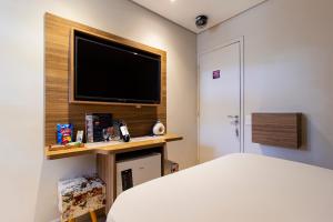 Postel nebo postele na pokoji v ubytování Motel Maresias - Radial Leste