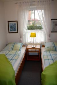 Cama o camas de una habitación en Ferienwohnung Südhoff