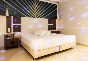 Postel nebo postele na pokoji v ubytování Motel Maresias - Radial Leste
