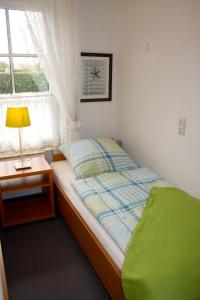 Cama o camas de una habitación en Ferienwohnung Südhoff