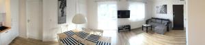 Televízia a/alebo spoločenská miestnosť v ubytovaní Apartament Zebra