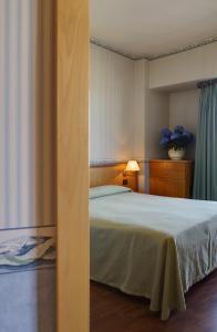 Кровать или кровати в номере Hotel Palace