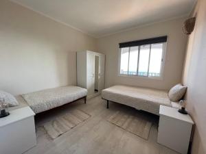 A bed or beds in a room at Casa Vista Pájaro