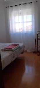 En eller flere senge i et værelse på Apartamento Abril