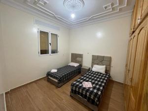 Postel nebo postele na pokoji v ubytování Appartement à louer