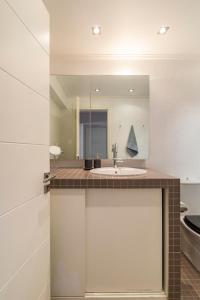 a bathroom with a sink and a mirror at Something different in Chalkida in Chalkida +56 photos