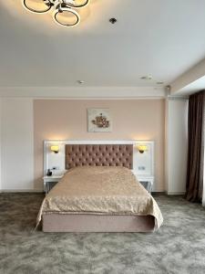 Postel nebo postele na pokoji v ubytování Mark Plaza Hotel