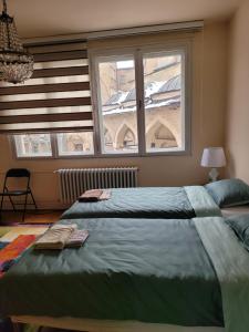 a bedroom with a large bed and a window at REMSA in Sarajevo