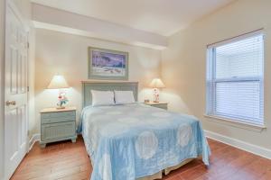 a bedroom with a bed and two night stands at Ocean Villa 406 in Panama City Beach