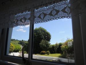 a window with a view of a road at Sally's Garden in Warrenpoint