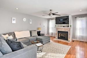 a living room with a couch and a fireplace at Norfolk Beach House Rental with Private Pool! in Norfolk