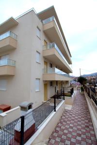 a building with a walkway in front of it at Apartment Nikola in Split
