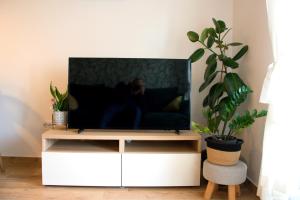 a flat screen tv sitting on a white entertainment center at Apartment Nikola in Split