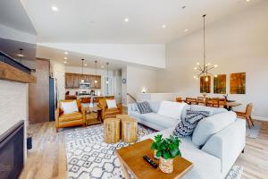 a living room with a couch and a table at Luxurious Escape in Durango Mountain Resort