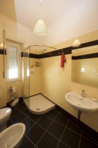 a bathroom with two sinks and a shower at Hotel Torre Di Milo in Maiori
