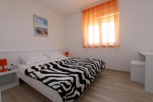 Postel nebo postele na pokoji v ubytování Villa Tamarut