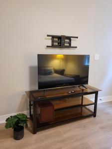 a living room with a coffee table and a bed at Feel like Home! in Langford