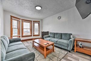 a living room with two couches and a coffee table at Vacation Rental about 2 Mi to Highmark Stadium! in Buffalo