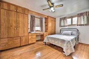 a bedroom with a bed and a dresser at Vacation Rental about 8 Mi to KeyBank Center! in Buffalo