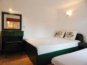 Ein Bett oder Betten in einem Zimmer der Unterkunft Hotel Pilalidis