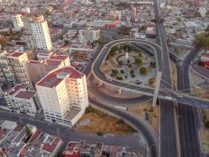 an overhead view of a city with a highway at Mision Puebla Angelopolis in Puebla