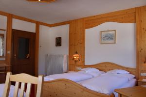 Postel nebo postele na pokoji v ubytování Waldgasthof Passegger
