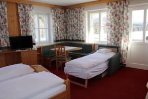 Postel nebo postele na pokoji v ubytování Waldgasthof Passegger