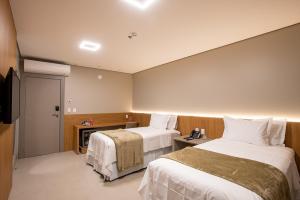 Amazon Aeroporto Hotel客房内的一张或多张床位