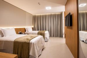 Amazon Aeroporto Hotel客房内的一张或多张床位