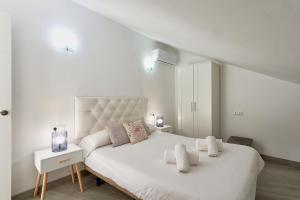 Posteľ alebo postele v izbe v ubytovaní Capitán - Apartamento en el autentico centro de Málaga
