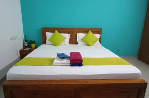 Una cama o camas en una habitación de Oyster Marris Homestays Thiruvananthapuram Award winning Homestay