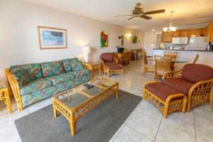 a living room with a couch and chairs and a table at Hale Kamaole 158 in Wailea