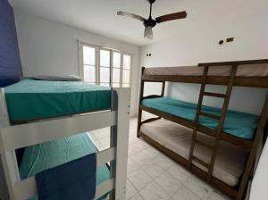 Postel nebo postele na pokoji v ubytování Pousada Linda In Ipanema