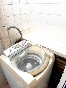 a dirty bathroom with a toilet in a room at Pousada Linda In Ipanema in Rio de Janeiro