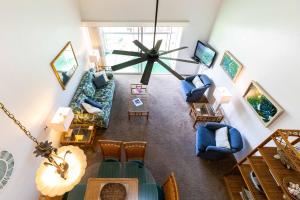 an overhead view of a living room with blue furniture at Hale Kamaole 308 in Wailea