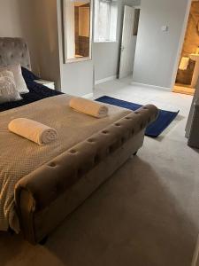 a bed with two pillows on it in a bedroom at Silver Dream in Southend-on-Sea