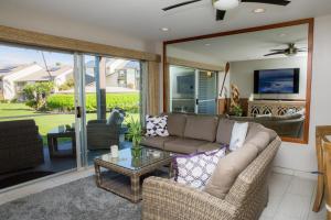 a living room with a couch and a table at Hale Kamaole 176 in Wailea