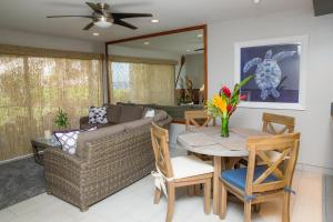 a living room with a couch and a table at Hale Kamaole 176 in Wailea