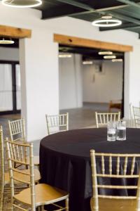 a black table and chairs in a room at The Tangerine Motel 