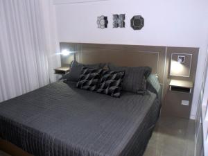 Un pat sau paturi într-o cameră la DZAIN 2, parrilla, playroom, gym , Cochera privada ,Todo cerca