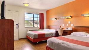 Ένα ή περισσότερα κρεβάτια σε δωμάτιο στο Motel 6-San Angelo, TX +42 φωτογραφίες