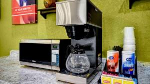 a coffee maker sitting on a counter next to a microwave at Motel 6-Lake Havasu, AZ - Lakeside in Lake Havasu City