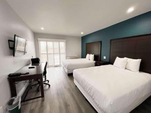 Un pat sau paturi într-o cameră la Motel 6 Vallejo, CA - Napa Valley