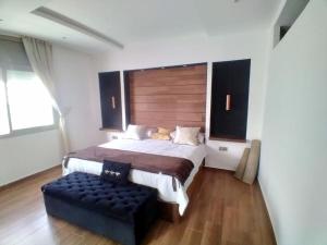 מיטה או מיטות בחדר ב-Villa de luxe piscine